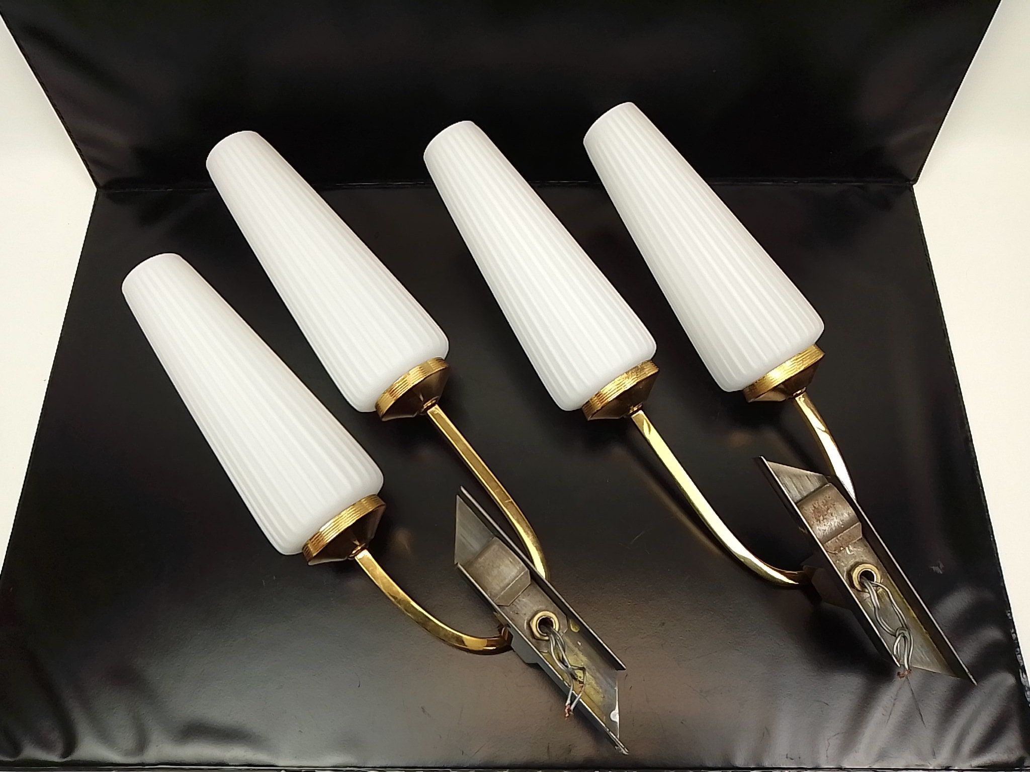 Pair of wall lamps in gilded metal and opaline style white glass