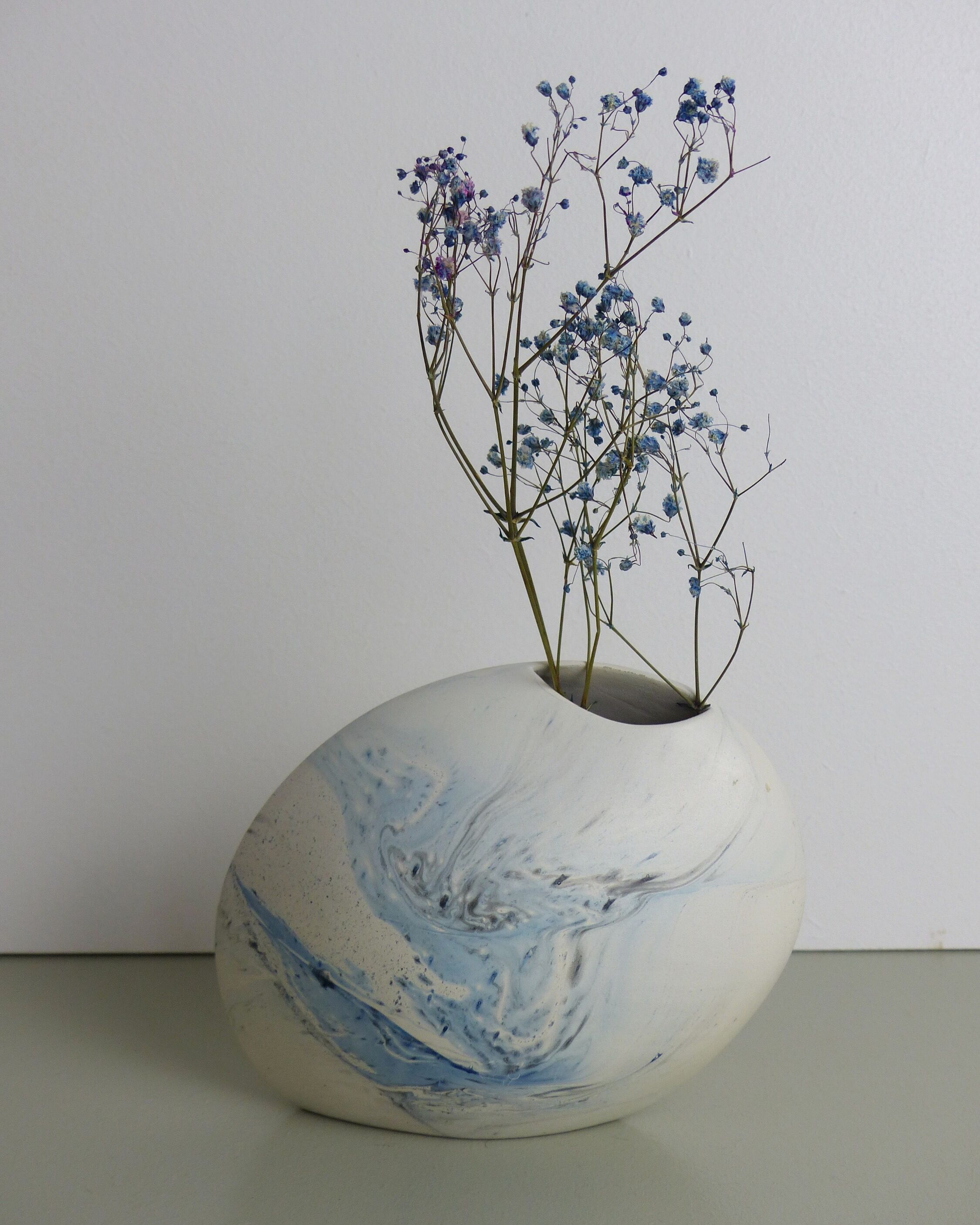 White and blue oval vase