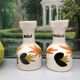 Old vinegar and oil maker with vintage decoration floral motifs