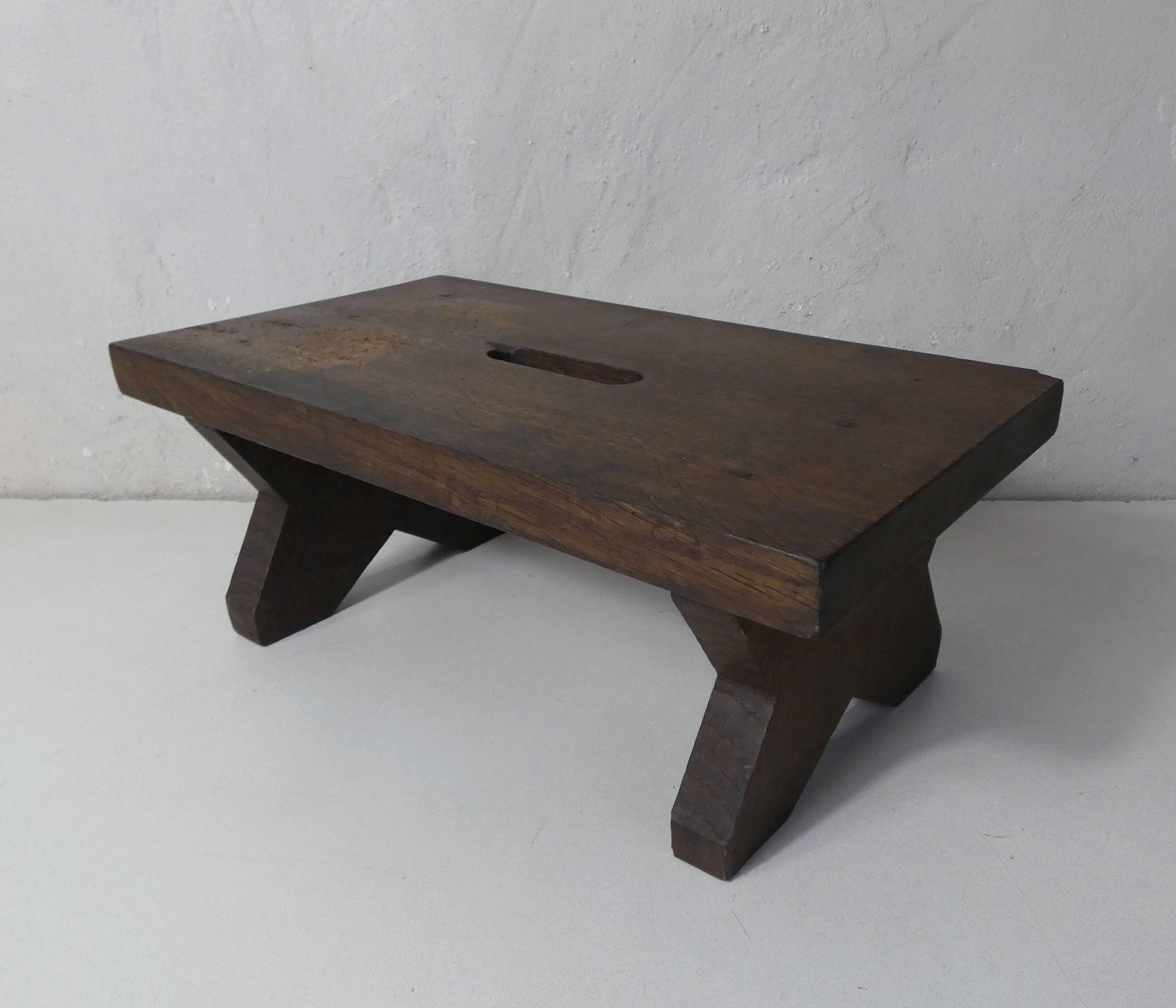 Old small wooden bench step in solid oak