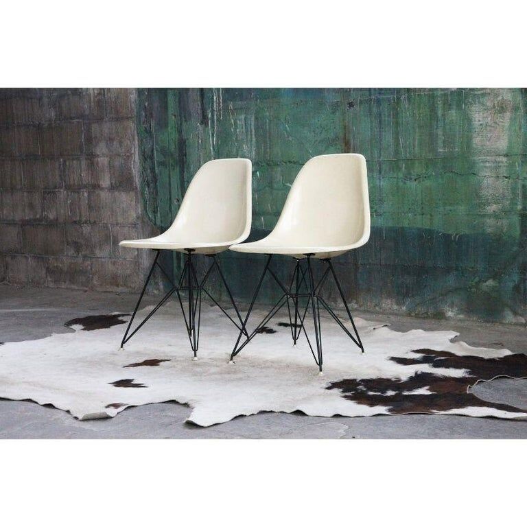 Pair of vintage Charles Eames eggshell and fiberglass chairs