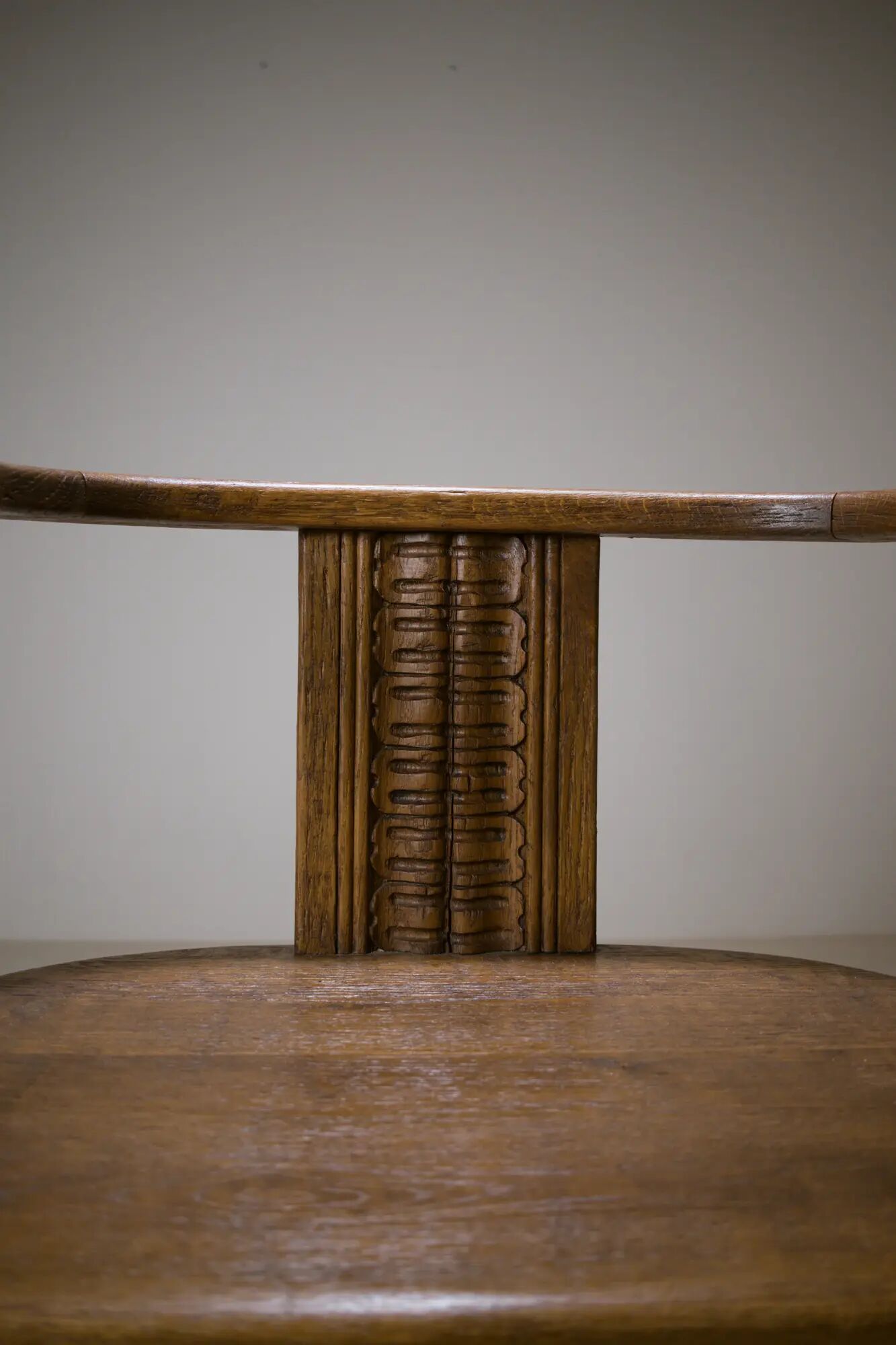 Swivel armchair in carved oak with ball bearings, early 20th century.