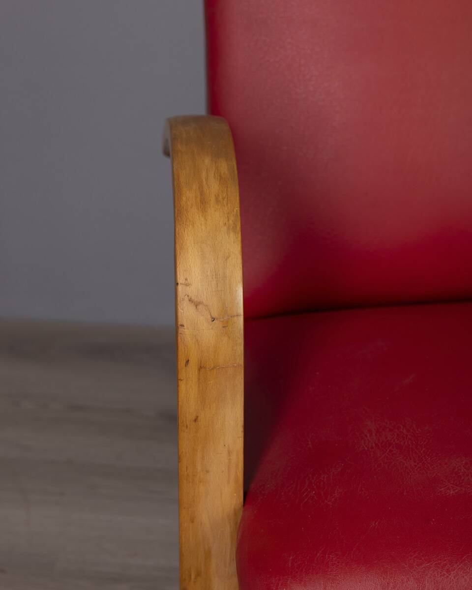 Pair of vintage 1950's armchairs in red leather, italian design