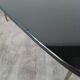 Table basse tripode en verre noir vintage