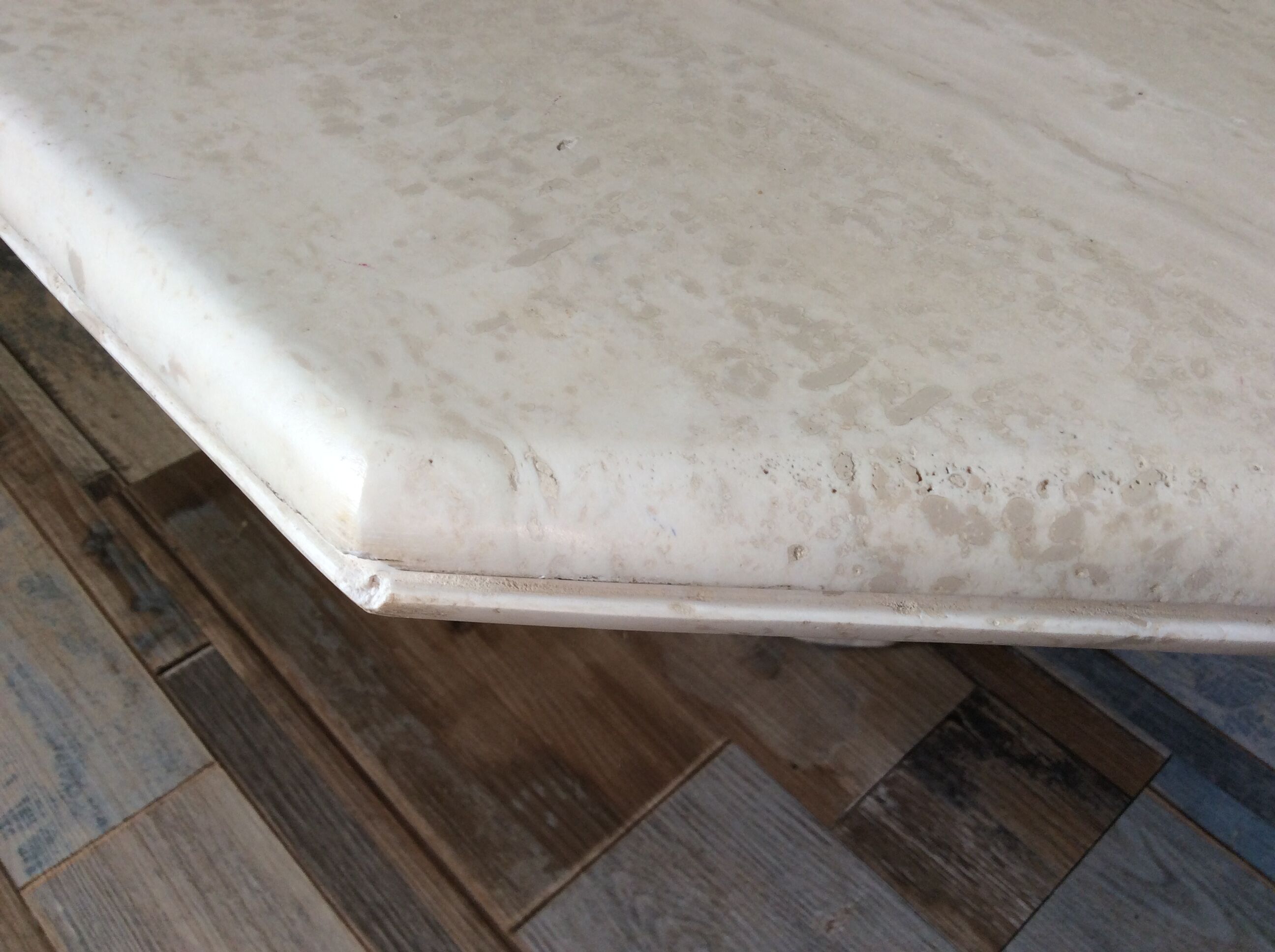 Octagonal coffee table in travertine