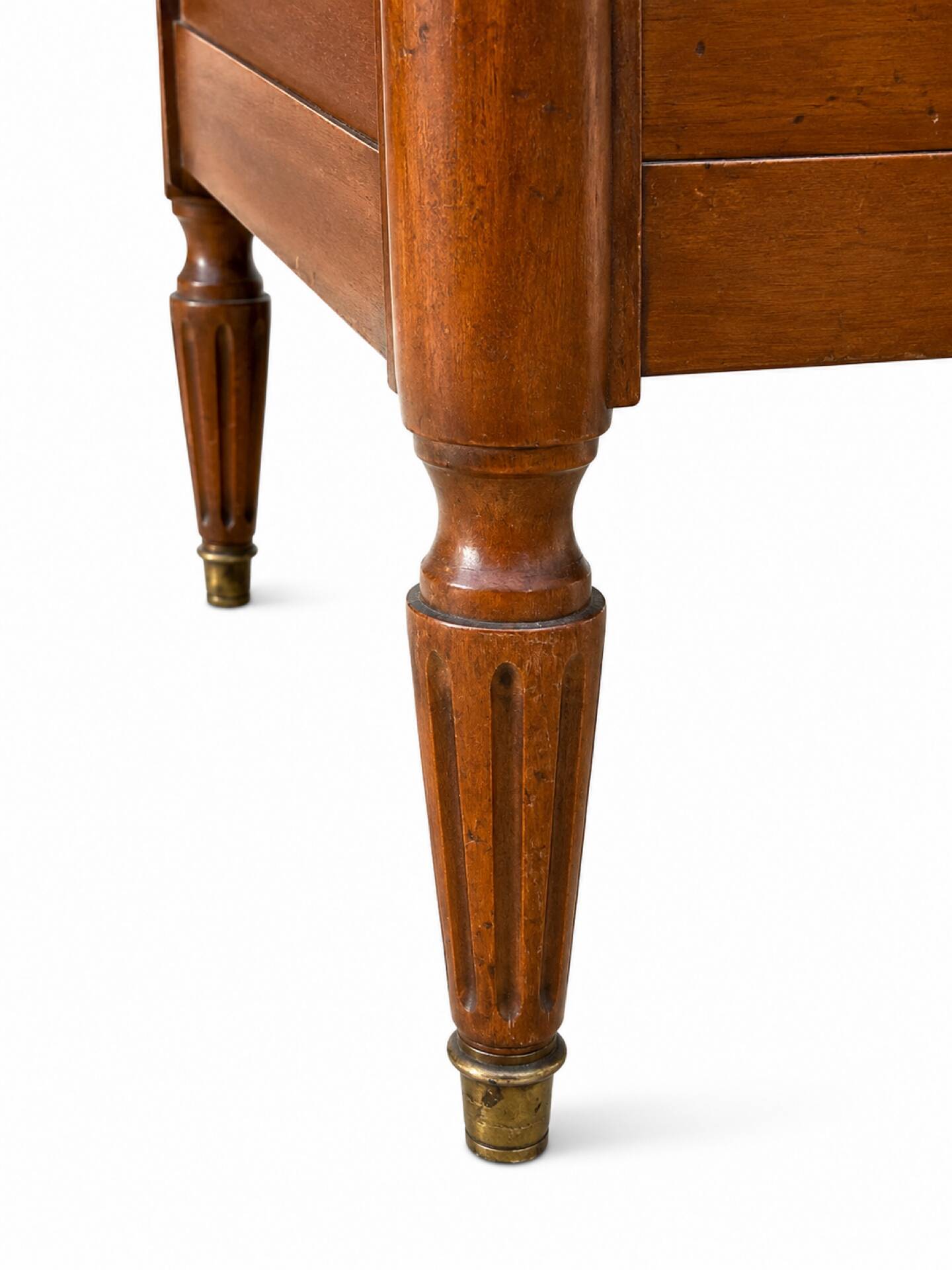 Light walnut commode in Louis XVI style with fluted motifs and three drawers.