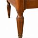 Light walnut commode in Louis XVI style with fluted motifs and three drawers.