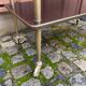 Brown rosewood rolling table with gold fluted legs