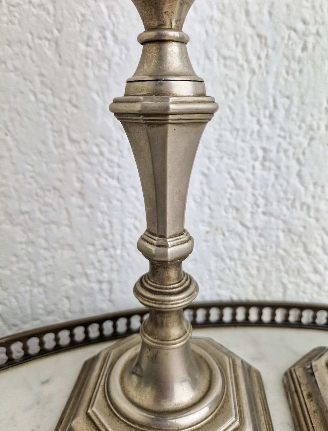 Pair of neo classical style candle holders in silver metal