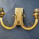Pair of bronze wall sconces with 1940s Art Deco lampshades.