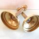 Pair of empire style brass candlesticks