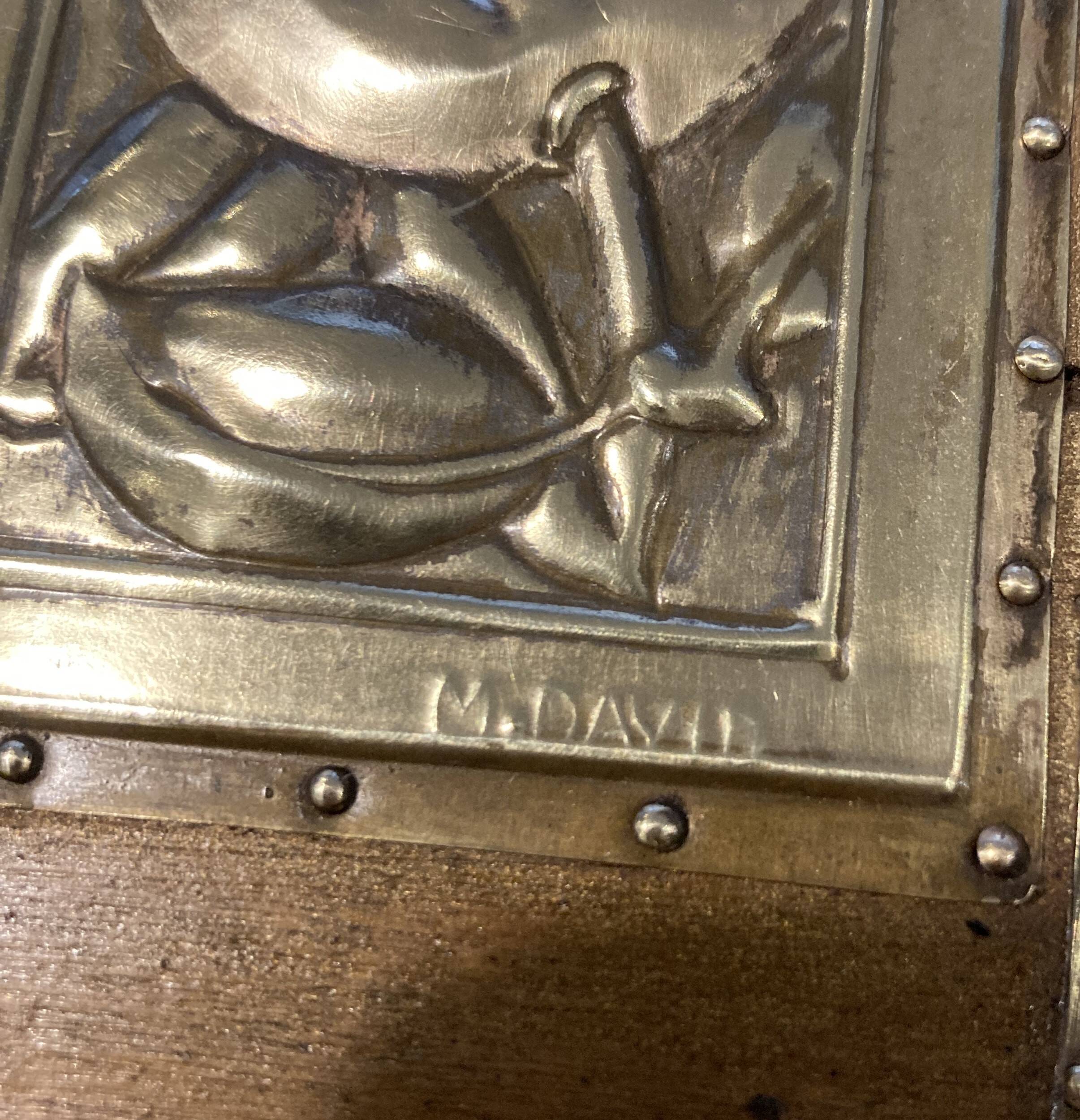 Pair of Art Deco wood and embossed metal landscape frames