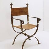Curule armchair in wrought iron and leather