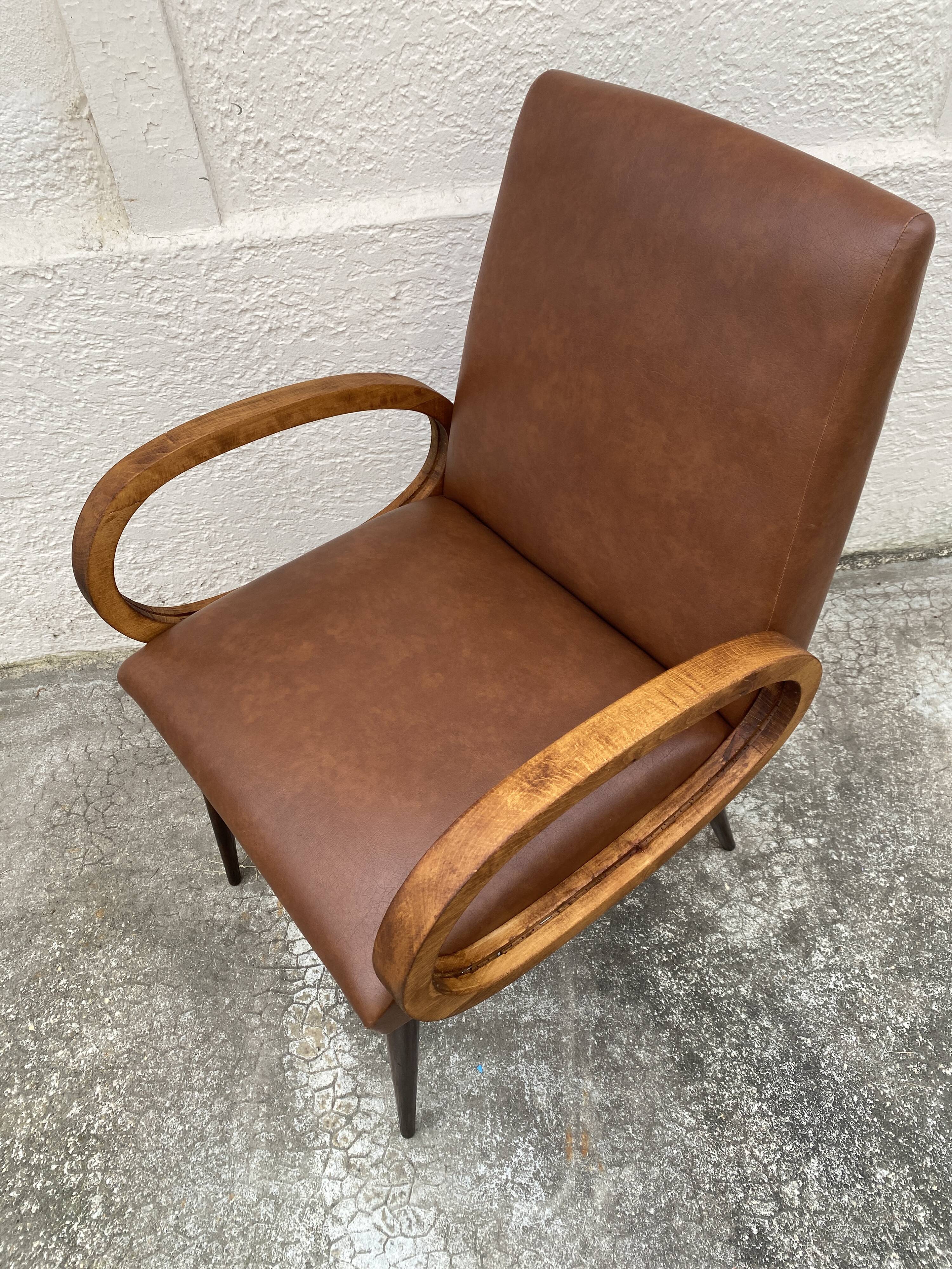 Mid-Century Scandinavian vintage retro armchair with oval armrests.