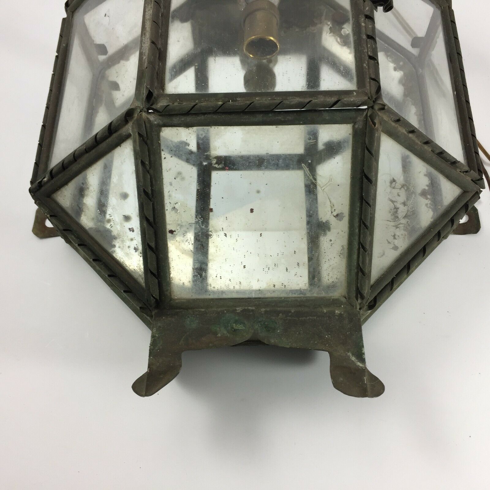 Metal and brass wall light with mirror background 1900