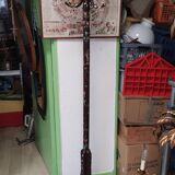 Wooden parrot coat rack with painted floral decoration.