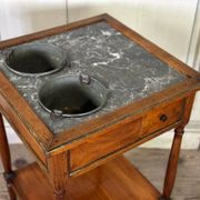 Refreshment table in mahogany, grey marble top, two zinc buckets, 18th century.