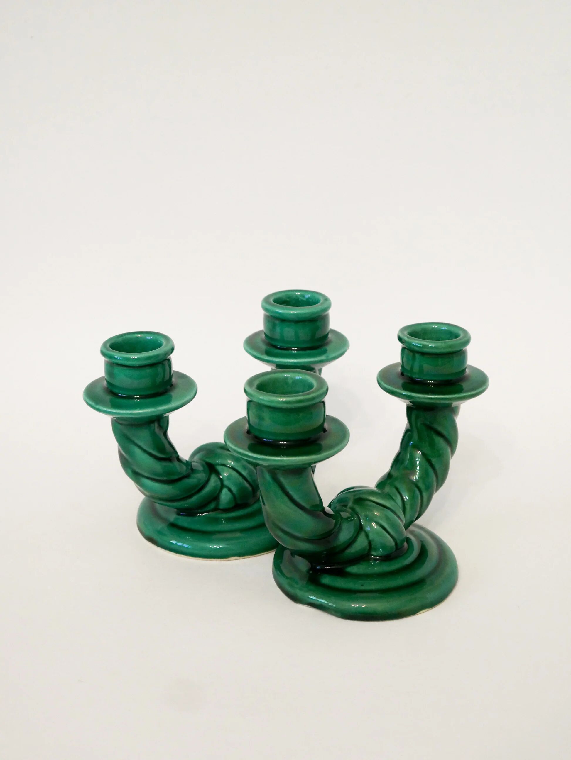 Pair of twisted green ceramic double candlesticks, 1960.