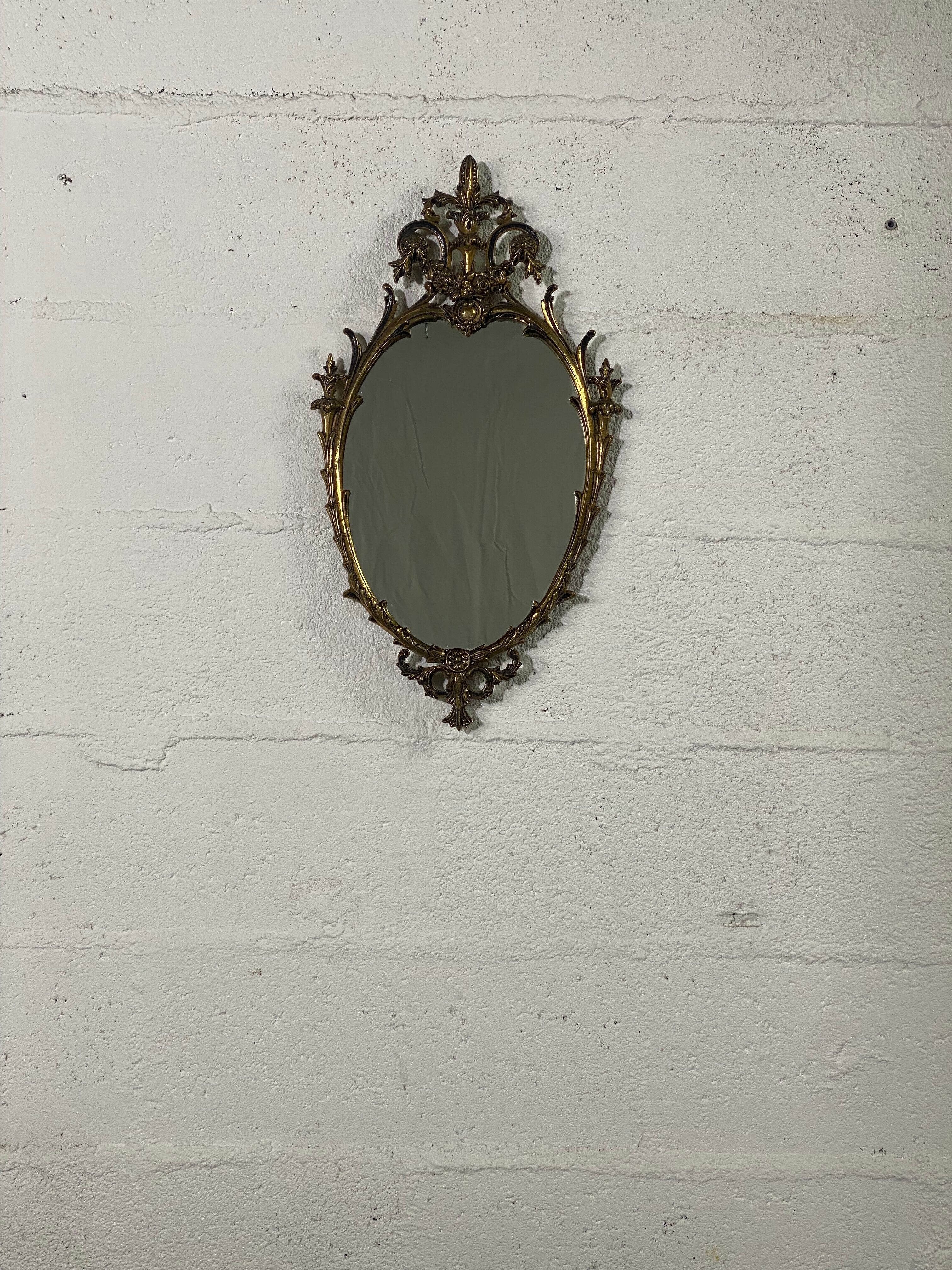 Oval gilded mirror