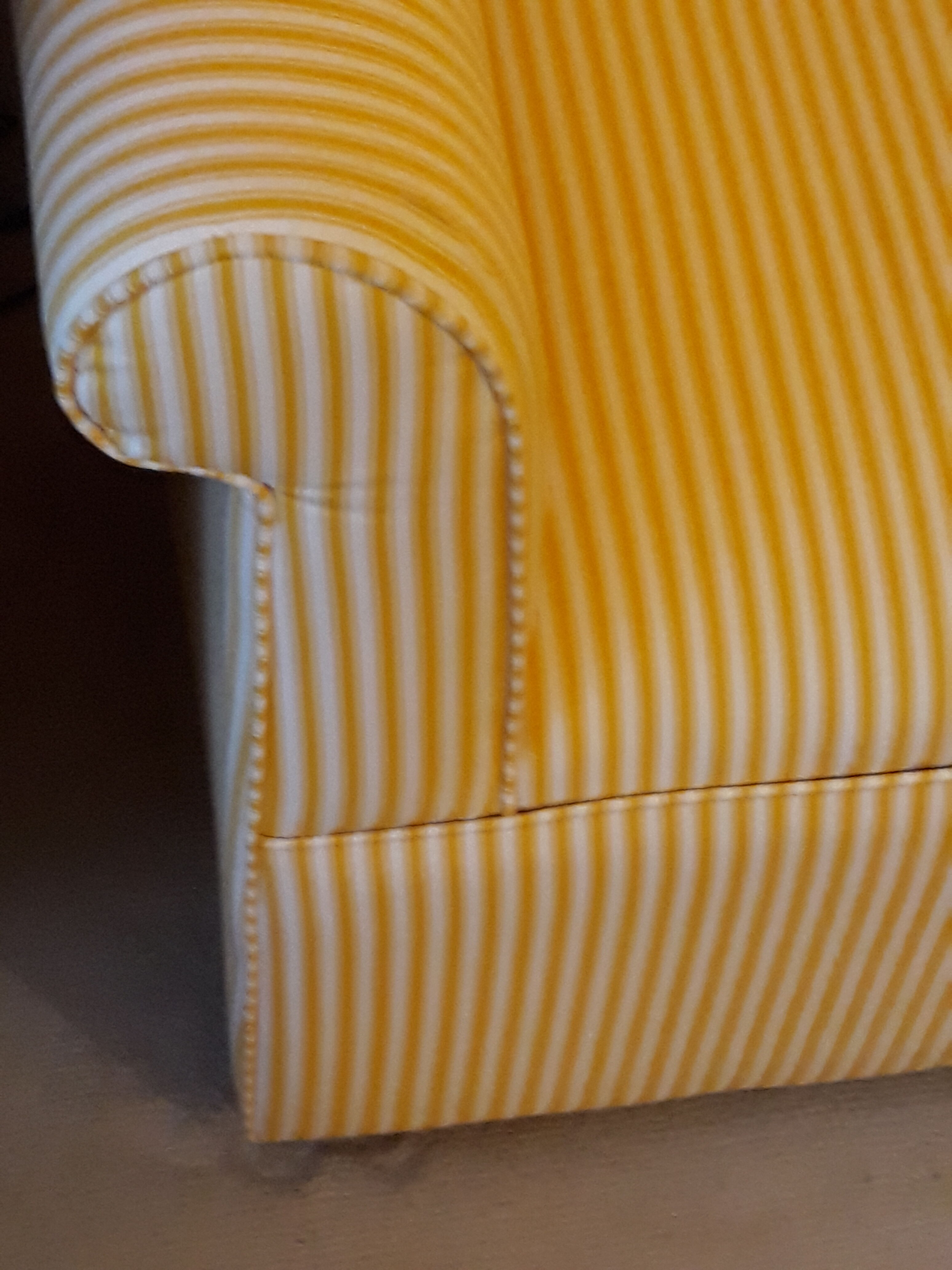 Club armchair in yellow and white striped fabric