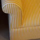 Club armchair in yellow and white striped fabric