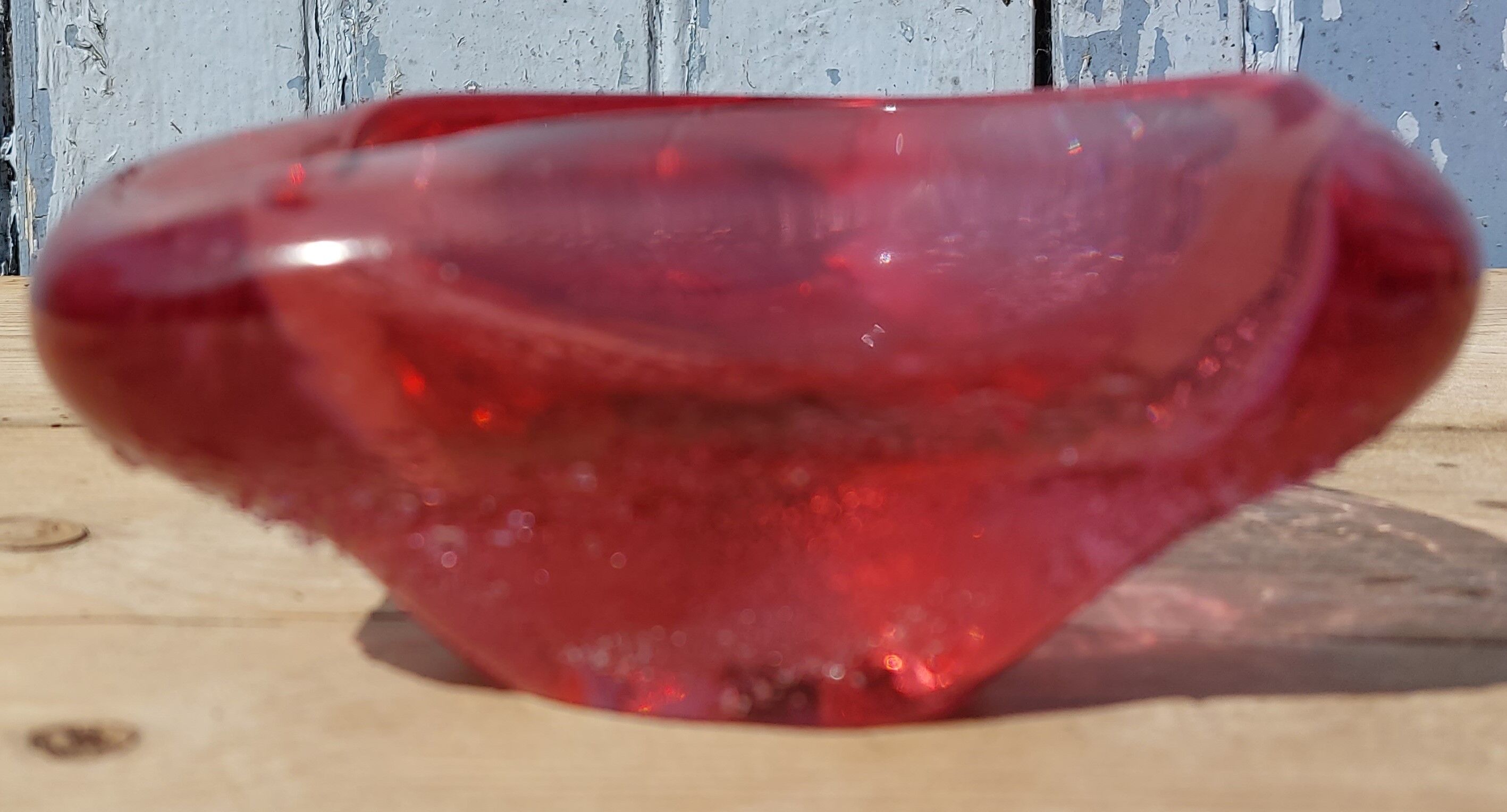 Empty pink blown glass pocket