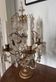 Candle holder or candelabrum with four arms of light.