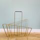 Asymmetrical gold metal magazine rack – 1960s