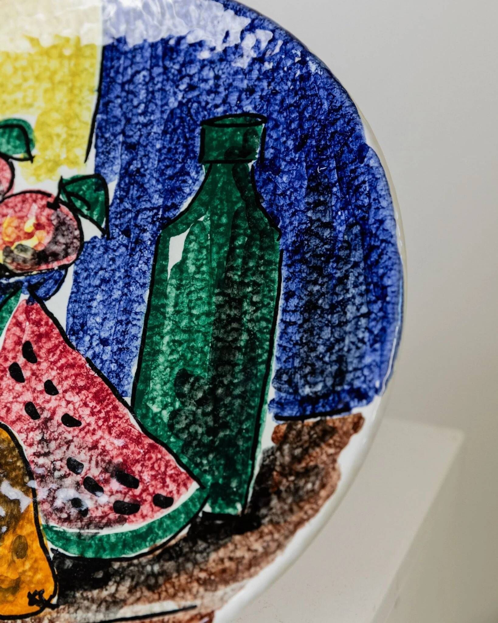 Multicolored hand-painted ceramic wall plate with 1960s Italian fruit motif, signed Stile