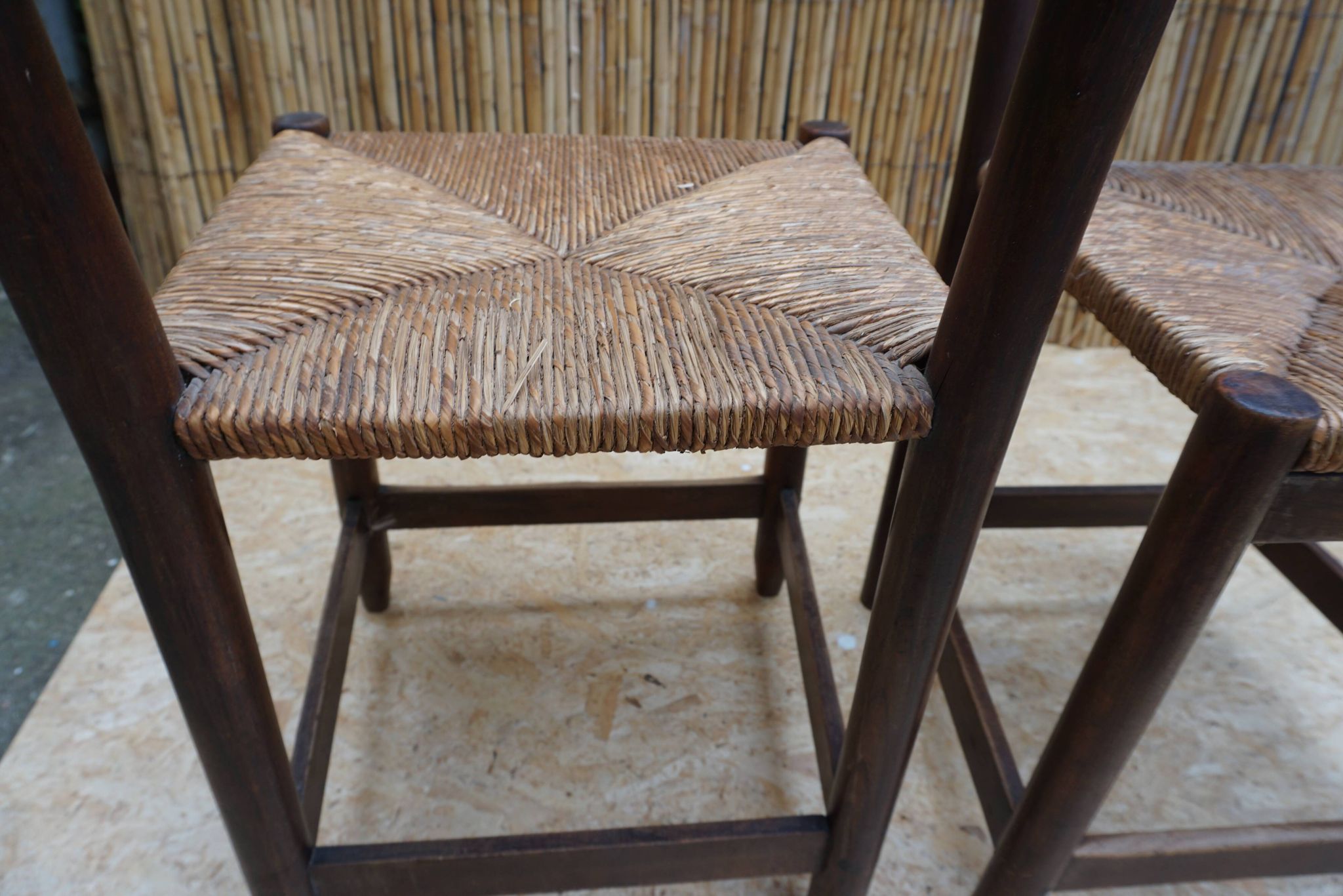 Pair of antique straw-seated farm chairs