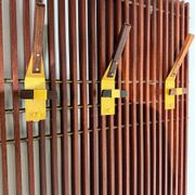 Modular coat rack in wood and brass, Italy, 1950s