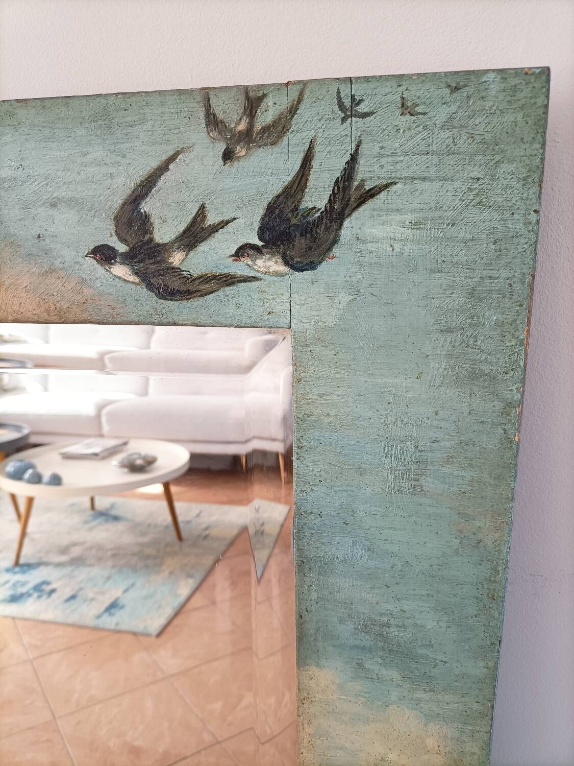 Very large mirror painted in Victorian style.