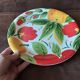 Quadrifoglio dish. Italian. Fruit and flower decoration. Shimmering colors.