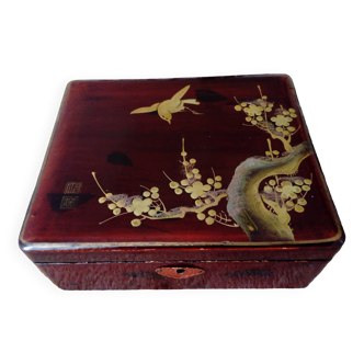 Lacquered wooden jewelry box with golden cherry tree branch decoration