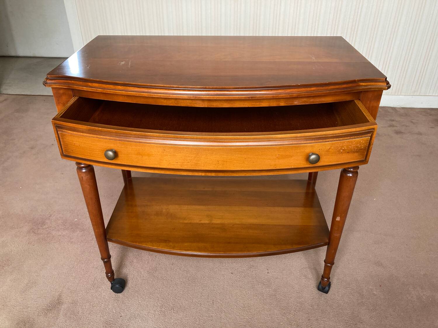 Wooden TV cabinet on casters