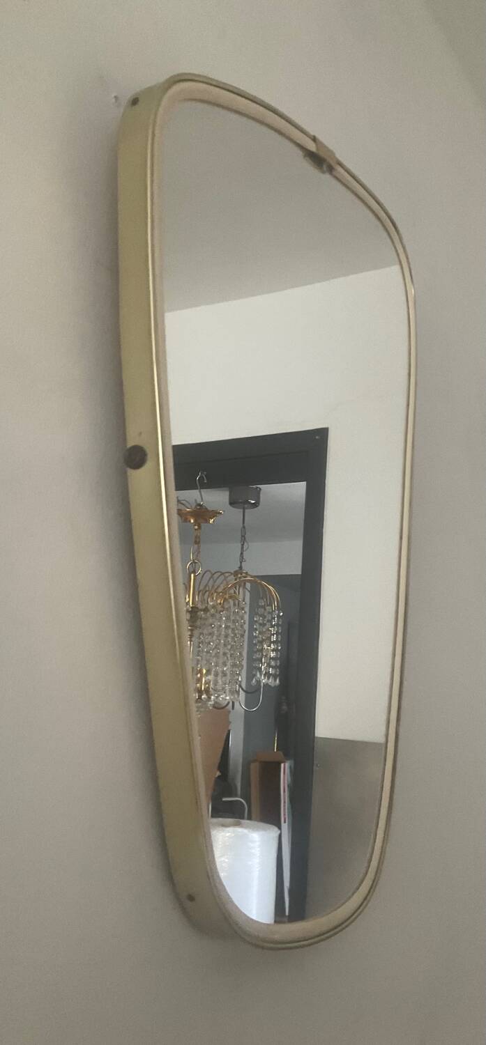 Asymmetrical free-form mirror from the 70s