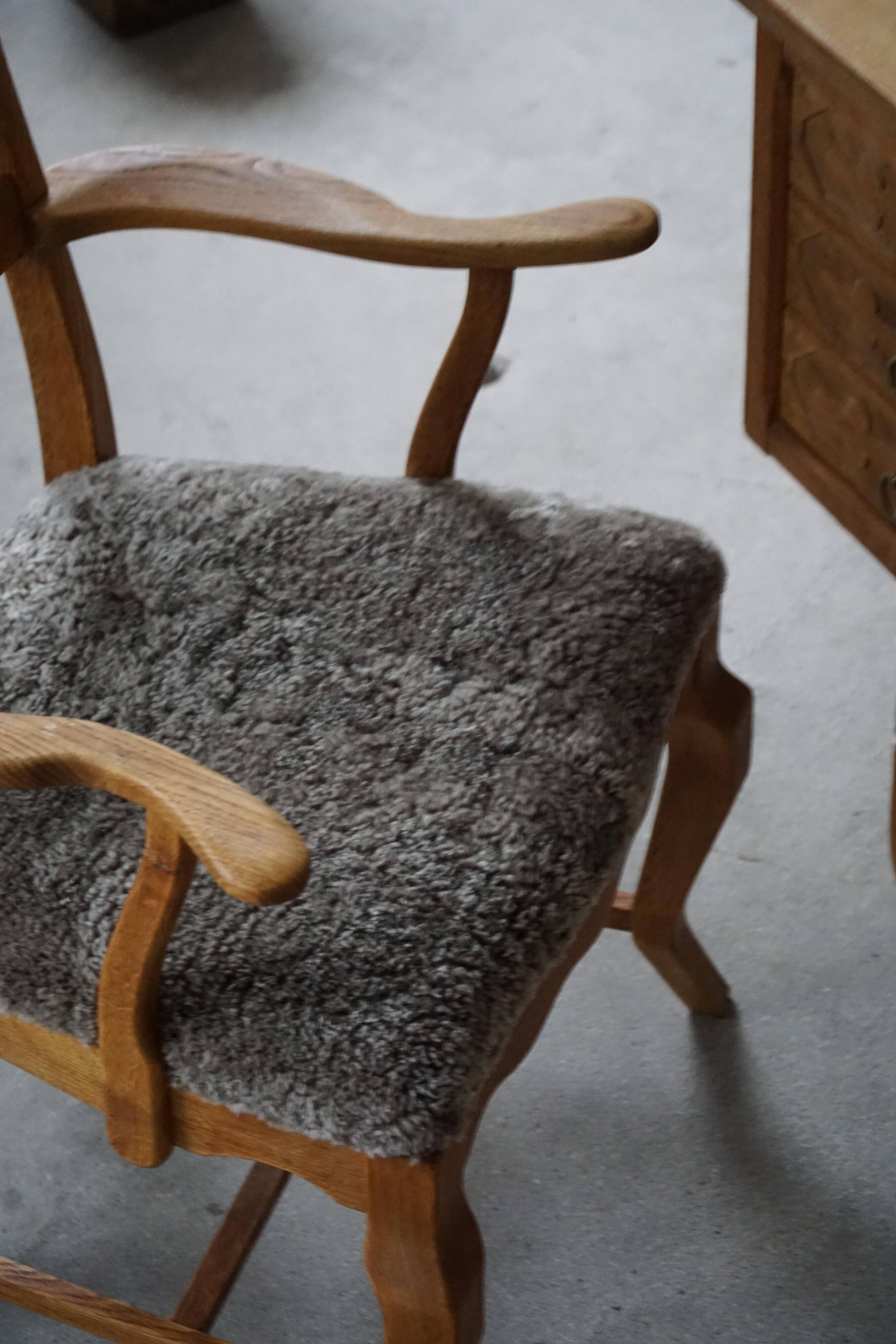 Razorblade armchair from the mid-20th century by Henning Kjærnulf, oak and lambswool, 1960.