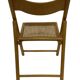 Chaise pliante vintage en bois avec assise en rotin design minimaliste des années 80