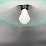 Frosted glass flower pendant with a water green edge.