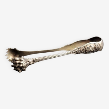 Old sugar tongs in solid silver