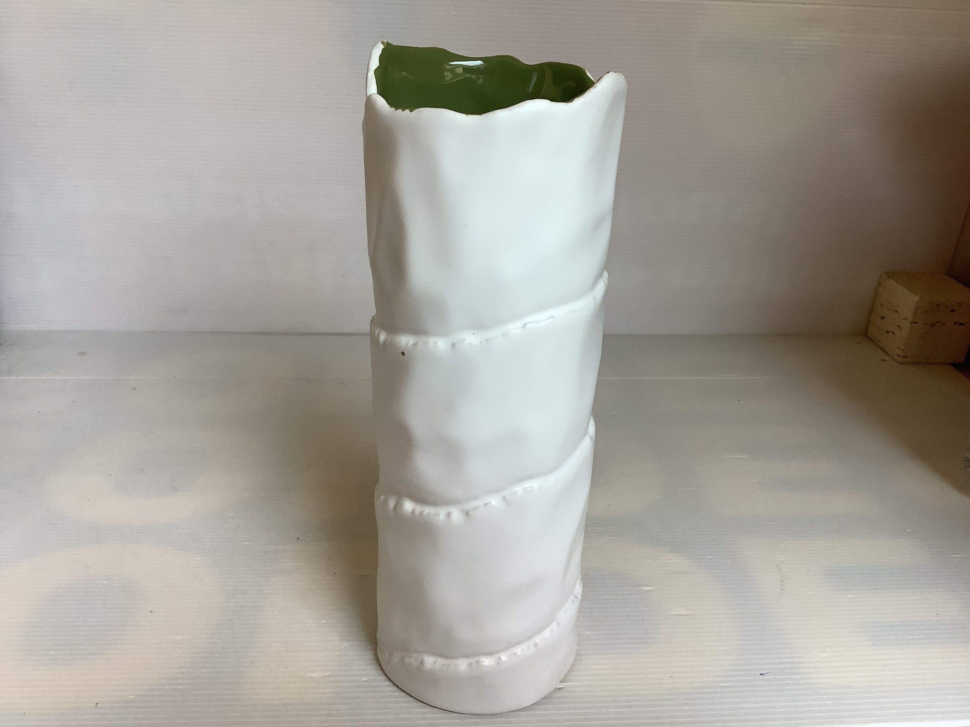 Vase with patterns of rolled paper leaves