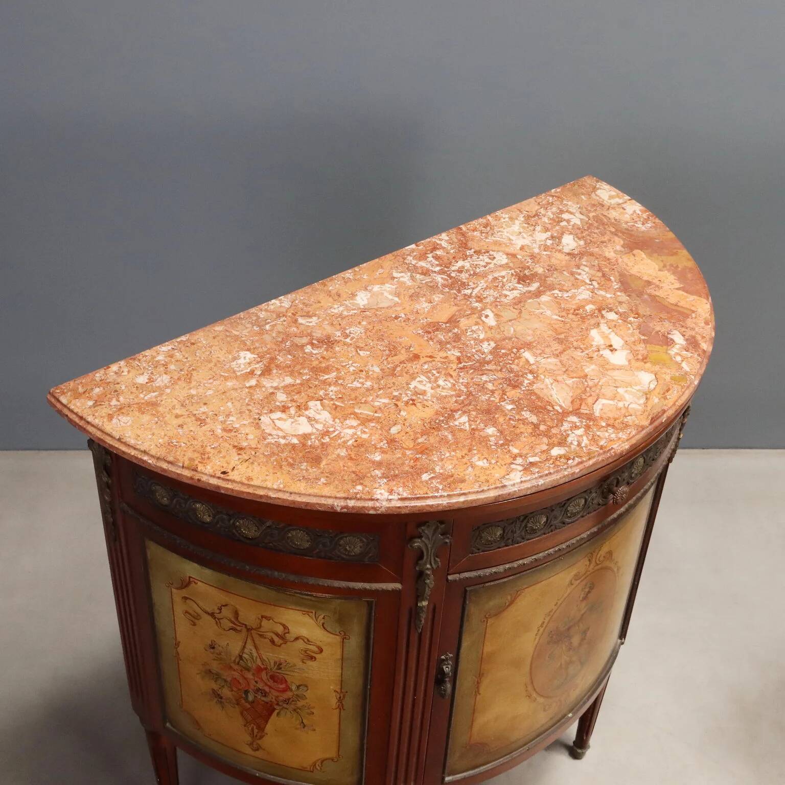 Antique demi-lune buffets in neoclassical style in mahogany from the 20th century.