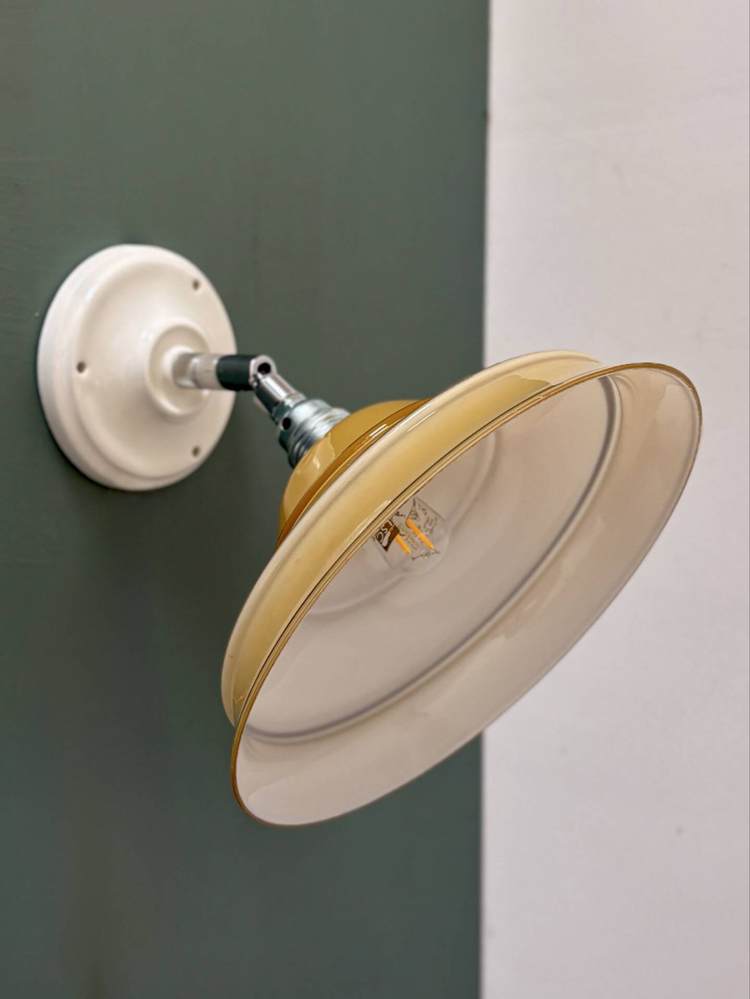 Vintage lampshade in yellow opaline with silver trim.