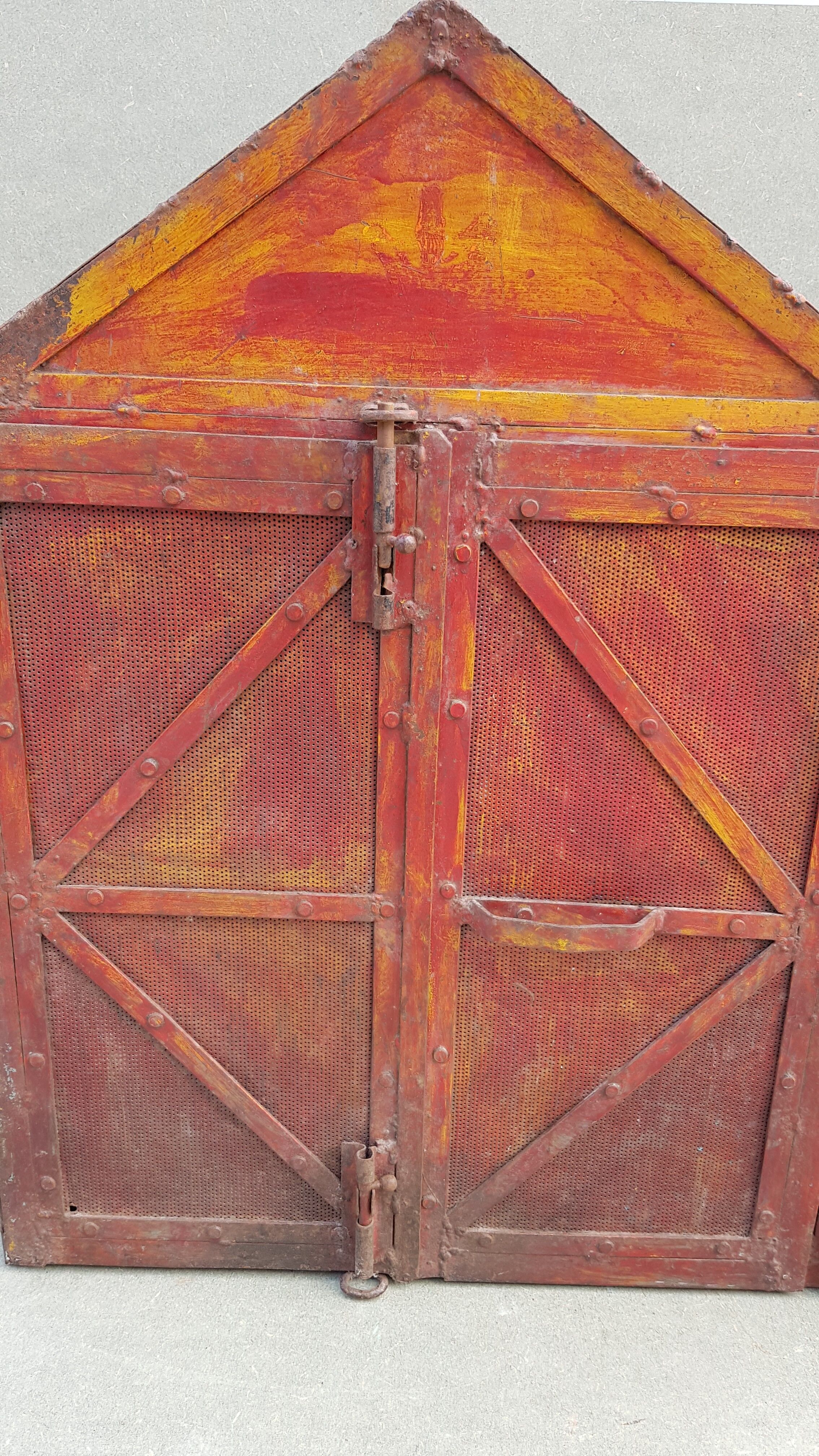 Old atypical metal workshop furniture with its original red patina