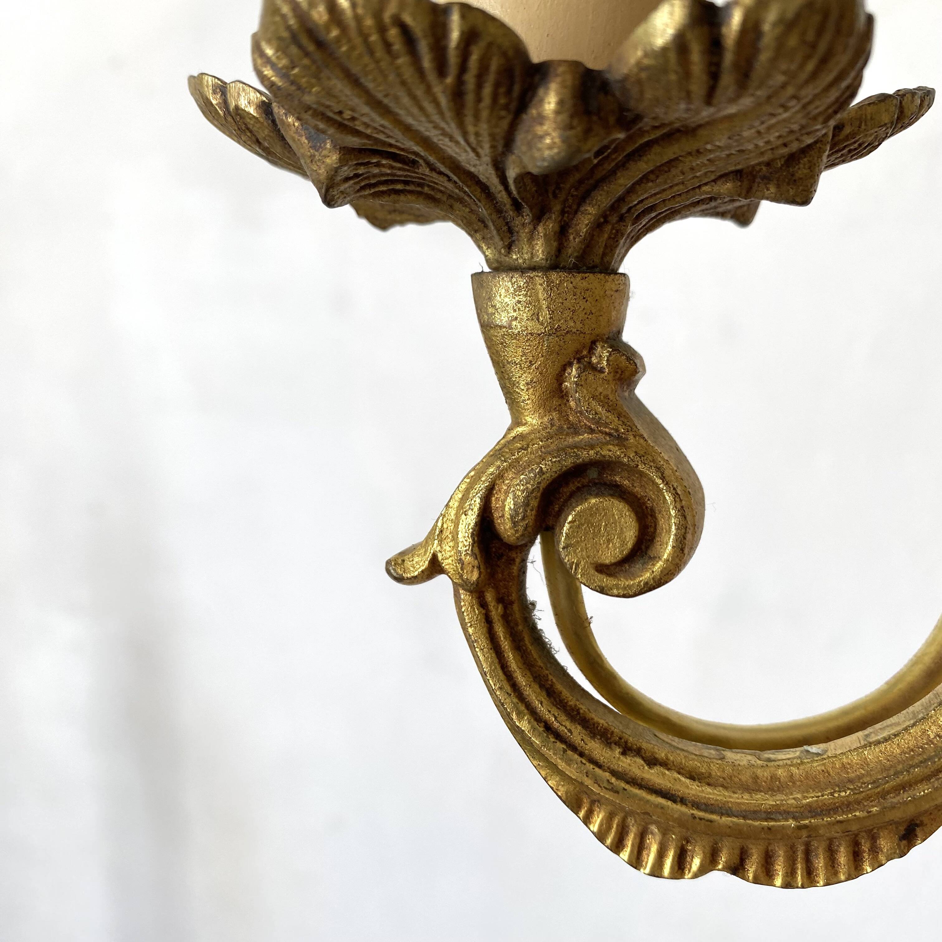 Pair of golden rococo-style wall lights