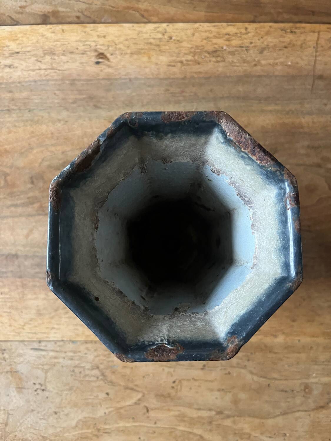Antique enamelled cast iron vase