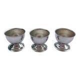 A set of 3 egg cups by Guy Degrenne.