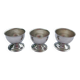 A set of 3 egg cups by Guy Degrenne.