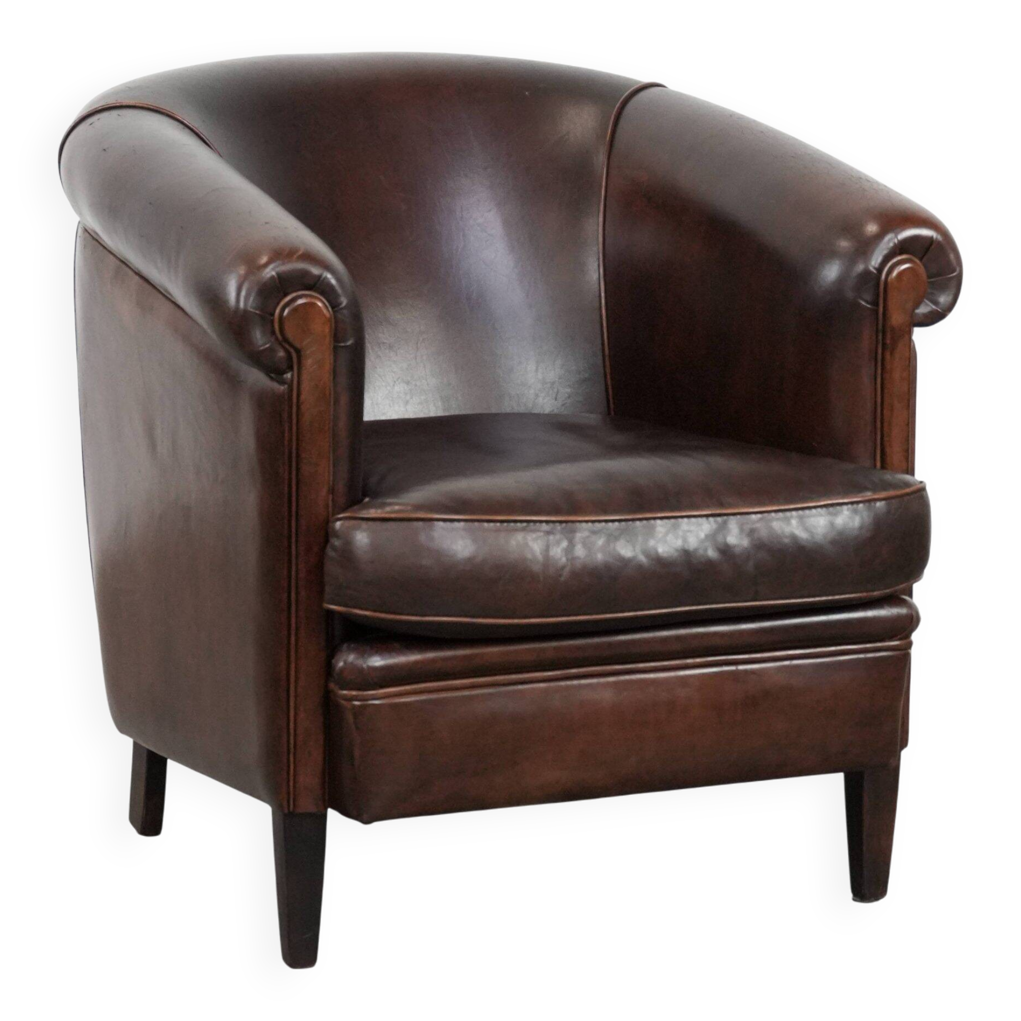Dark brown vintage club armchair in English style made of sheepskin leather