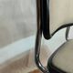 Cesca B32 chair by Marcel Breuer, upholstered in beige fabric.
